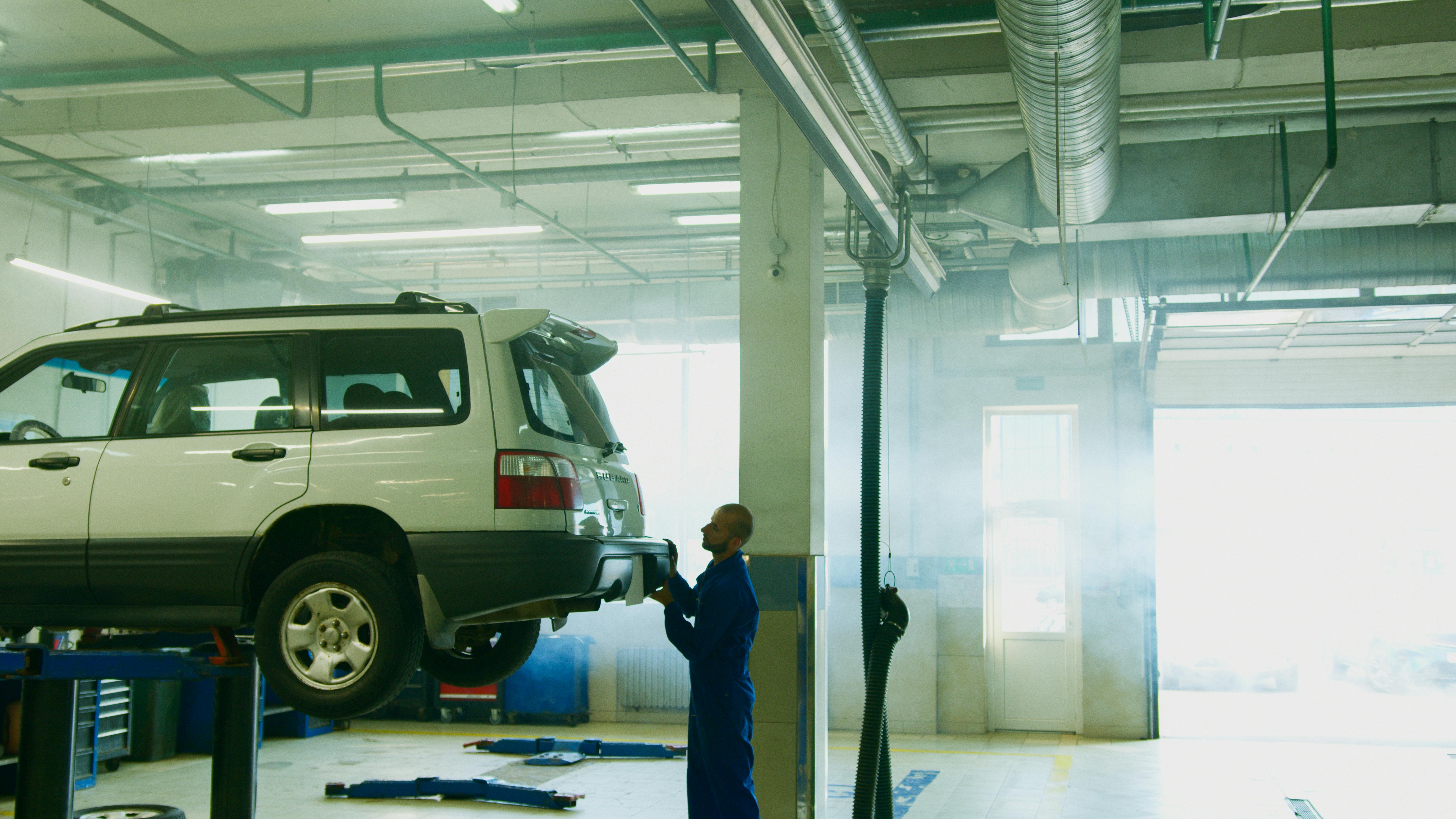 Vehicle on lift for hitch installation service